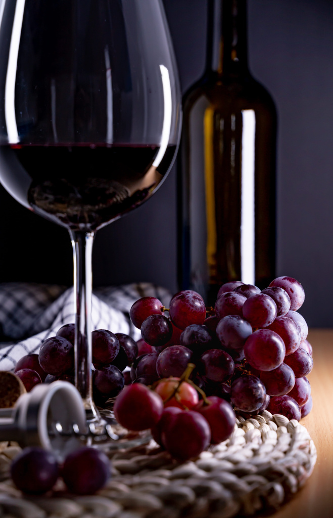 vertical-shot-glass-red-wine-grapes-table (1).jpg